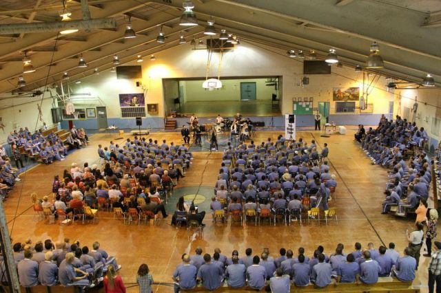 I climbed up two rickety old ladders to get to a dusty old balcony to get this shot. There were more than 400 prisoners who heard a message of hope.... As well as some really kick ass music.