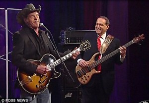 I thought about putting a picture of Rosa Parks or MLK here, but instead I'll just post this pic of Mike playing base with Ted Nugent. AKA, 